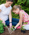 Woman and child using Three Tine Claw Garden Rake With Ergonomic Handle And Stainless Steel Build in garden prep