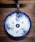 USZWBY Vessel Sinks Blue and White Porcelain Bathroom Basin Sink Round Ceramic Art Countertop Washbasin Bathroom Bowl Sink with floral design from above.