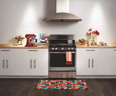 Modern kitchen setting with a stove illuminated by Reveal HD Appliance Light Bulb 40 Watt, 320 Lumens, highlighting oven and decor.