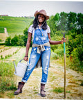 Person holding Multi Functional Manure Fork With Iron Construction For Efficient Lawn Maintenance and Gardening Handheld Design.