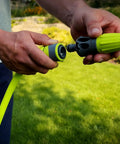 Person connecting Garden Hose Quick Connect Fittings Kit With Flow Stop Couplers And Plug, 3-Piece No-Sweat Set on hose