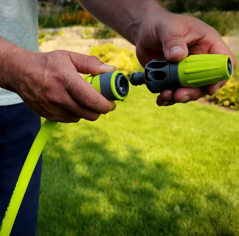 Person connecting Garden Hose Quick Connect Fittings Kit With Flow Stop Couplers And Plug, 3-Piece No-Sweat Set on hose