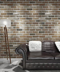 Peel And Stick Faux Brick 3D Wall Panels 10 Pack 52.5 Sq Ft In Gray Brown for Easy DIY Accent Walls in living room setting with sofa.