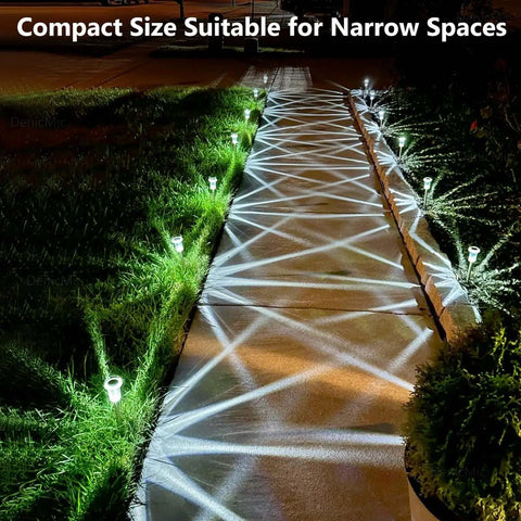 Solar LED Outdoor Stake Lights Pack Of 10 illuminating a pathway with cool white light at night