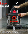 Person using 8 Gallon 6 Peak HP Wet Dry Vacuum For Home Garage And Workshop With Built In Drain and Multifunction Attachments
