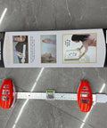 Professional 3 In 1 Picture Hanging Tool And Spirit Level features measuring ruler and magnetic driver on a gray surface.
