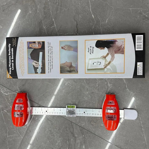 Professional 3 In 1 Picture Hanging Tool And Spirit Level features measuring ruler and magnetic driver on a gray surface.