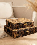 Two natural water hyacinth wicker storage baskets with lids set of 2 handwoven organizer bins on a wooden table.