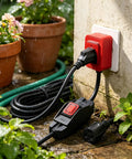 Heavy Duty 3 Prong Extension Cord Built Solid With Real 14 AWG Cable 6.6 Ft Black Wire Works Like A Charm On Power Tools And Home Gear Plus Inline Switch, plugged in outdoors with water droplets.