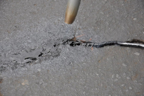 Application of 125 Feet Of Blacktop Crack Filler For Asphalt And Concrete Weather Resistant No VOCs on pavement crack