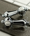 Handles of Widespread Lavatory Faucet With Brass Pop Up No Drip Ceramic Disc, Polished Chrome Finish on tile surface