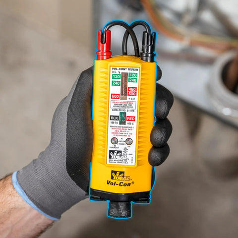 Vol-Con Solenoid Voltage Tester With Vibration Alert, Continuity Function, held by hand, showing AC DC Voltage Detection, yellow tool