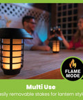 Color Changing Solar Pathway Lights Outdoor IP67 Waterproof Solar Powered Garden Lights For Walkways Yard Backyard Lawn Or Landscape 4 Pack With Auto Color Cycling And Energy Saving LED in lantern style mode on a table with people enjoying outdoor evening atmosphere.