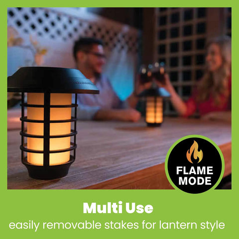 Color Changing Solar Pathway Lights Outdoor IP67 Waterproof Solar Powered Garden Lights For Walkways Yard Backyard Lawn Or Landscape 4 Pack With Auto Color Cycling And Energy Saving LED in lantern style mode on a table with people enjoying outdoor evening atmosphere.