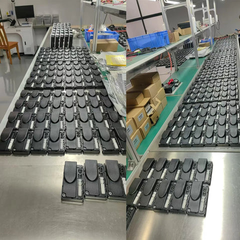 Many 1212P-2501 motor speed controllers on a factory assembly line, black rectangular modules.