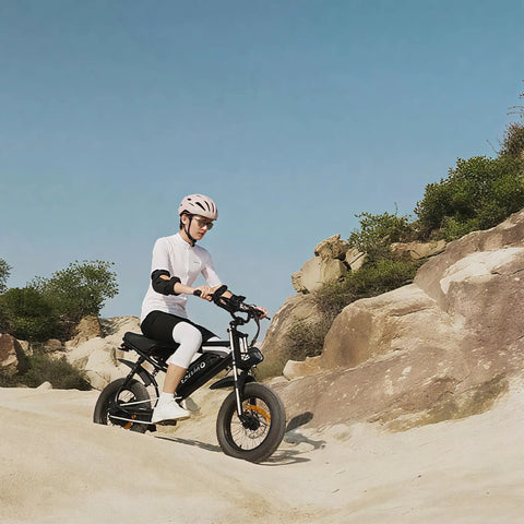 Rider on 16 Inch Fat Tire Electric Bike For Adults And Teens With Peak 1500W Motor 28 MPH Top Speed 65 Mile Range Ebike on rocky terrain