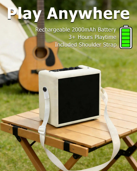 Cream white mini electric guitar amplifier with OTG recording on a table outdoors, showing shoulder strap and USB C connectivity.