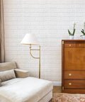 Cozy living room with White 3D Faux Brick Wallpaper Peel And Stick Panels For Easy DIY Home Makeover Waterproof Foam Brick Wall Decor