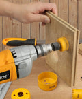 Six Piece Hole Saw Set With Arbor Adapter Makes Short Work Of Wood Metal Plastic Drywall Cutter Kit in use on wood.