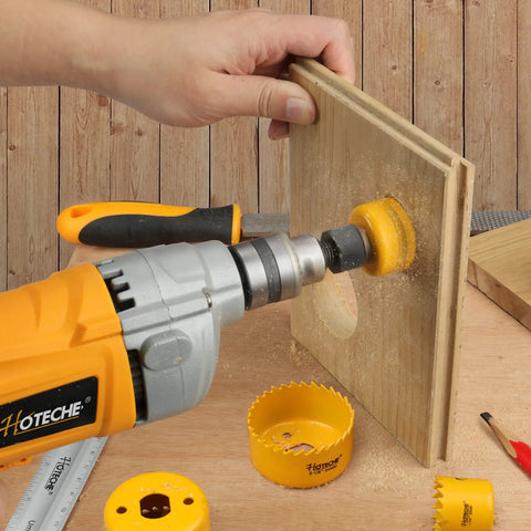 Six Piece Hole Saw Set With Arbor Adapter Makes Short Work Of Wood Metal Plastic Drywall Cutter Kit in use on wood.