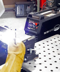 MIG 250 And TIG 225 AC DC Master Welding Kit with Flex Head WP 17 Torch in use, precise welds on metal fabrication table