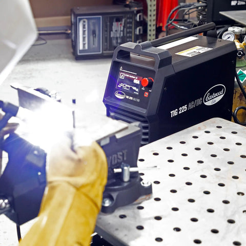MIG 250 And TIG 225 AC DC Master Welding Kit with Flex Head WP 17 Torch in use, precise welds on metal fabrication table