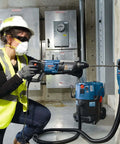 Bosch Bulldog SDS-Plus rotary hammer bit, 1/2 in. x 6 in. x 8 in., installed in a blue Bosch hammer drill.