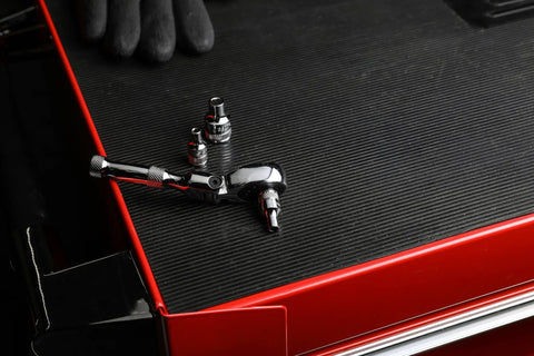 3/8-Inch Flex Head Ratchet With 72-Tooth Quick Release, Reversible, on red tool chest with attachments, chrome finish visible