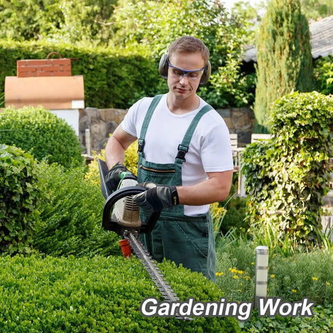 Man using hedge trimmer wearing Mens Work Gloves KG125M Mechanic Utility All Purpose With Heavy Duty Build X Large.
