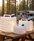 Collapsible Water Container With Spigot BPA Free Foldable Water Storage Jug With Handle shown on picnic table beside RV
