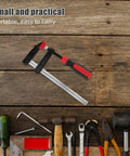 Heavy Duty F Clamp With 6 Inch Opening And Strong Clamping Pressure Perfect For Woodworking Welding Projects And Quick One Handed Operation In Your Workshop Setup on wooden surface with tools.
