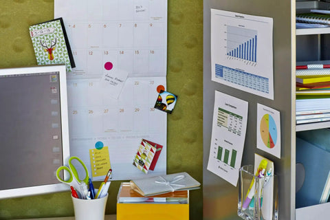 Office wall with calendar and notes secured using Removable Poster Tape With Dispenser, Handy Three Quarters Inch Wide By 12.5 Feet Clear