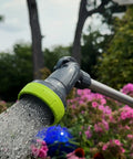 Garden Nozzle With 28 Inch Watering Wand, 3 Pattern Adjustable Sprays Jet Mist Shower in use over flowers