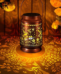 Outdoor Solar Lanterns Waterproof Weatherproof Metal Hummingbird Garden Decor glowing on a patio table with floral cutouts projection.