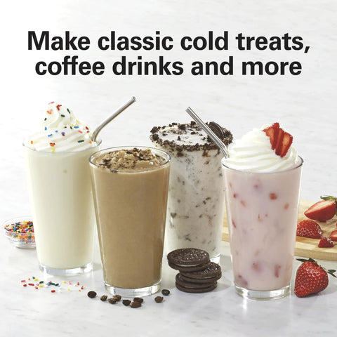 Four milkshakes with whipped cream and sprinkles, oreos, coffee bits, and strawberries, made with the DrinkMaster Electric Drink Mixer.
