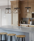 Coastal 1-Light Mini Pendant in Antique Bronze for Rustic Farmhouse Vibe above a kitchen island with wooden stools.