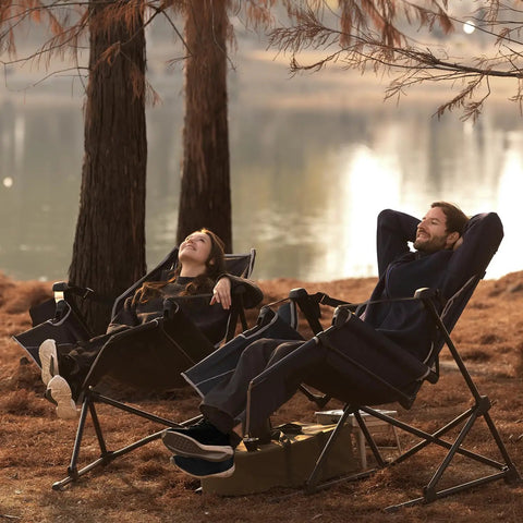 Two adults relax by a lake in Go Horizon Hammock Chair For Adults Up To 400 Lbs, Lie Flat Folding Camping Chair