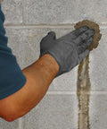 Person applying Fast Acting Hydraulic Water Stop Cement For Patching Leaks In Concrete And Masonry, Sets In 3 To 5 Minutes, Ideal For Pools