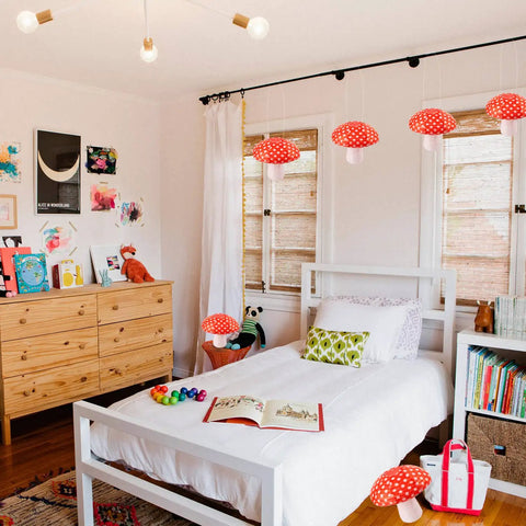 Bedroom with Six Pack Mushroom Paper Lanterns Set For Party Decor And Nursery Ornaments 3D Woodland Mushrooms in orange-red color.