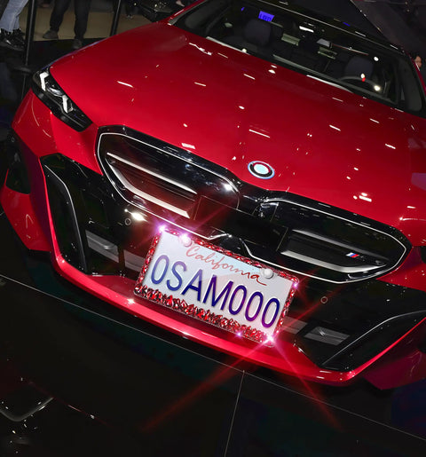 Red rhinestone license plate frame sparkly bedazzled stainless steel holder on car, fits standard 12.25 by 6.25 inch plates.