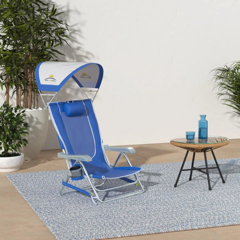 SunShade Backpack Beach Chair With Adjustable Canopy in Saybrook Blue on patio with cup holder and durable armrests.