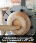 Lathe Chuck Jaws Set With Cole Jaws, 10 Inch And 5 Inch Extensions, holding a wooden bowl on a lathe.