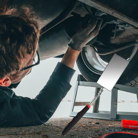Mechanic using Extendable Inspection Mirror 12 To 30 Inch Reach Flexible Rectangle Mirror With Retractable Long Handle under car