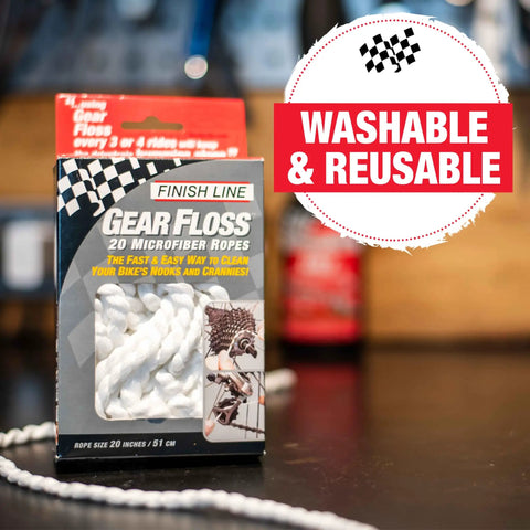 Microfiber Cleaning Rope For Bikes in box, labeled 'Washable & Reusable', product on wooden counter.