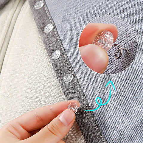 Close-up of hand using bed skirt twist pin with clear head for upholstery and slipcovers, demonstrating secure hold on fabric.