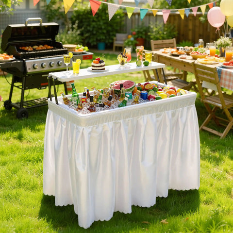 Two Tier Folding Ice Table With Drain And Detachable Skirt at BBQ party, filled with drinks and ice, surrounded by outdoor decor.