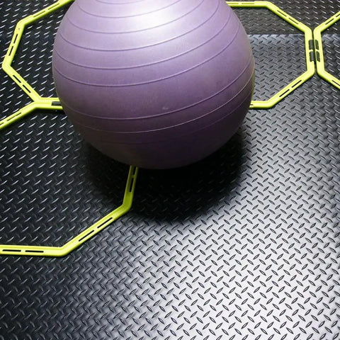 Diamond Plate Rubber Flooring Roll 3 mm Thick 4 Ft By 2 Ft Black Durable Industrial Grippy Floor Mat with gym ball and exercise rings