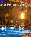 Lit Solar Pendant Lights With Amber Hammered Glass Shade And Edison Bulb Vibe glowing during rain by a pool, heat and snow resistant.