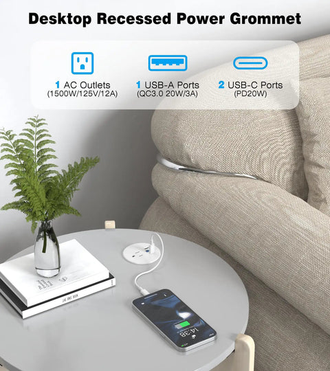 Recessed Power Strip Two Pack Desk Grommet Outlet 2.5 Inch Ten Foot Cord Triple USB Fast Charging Hub One AC Socket White Flush Desktop Charger installed on a gray table with a plant and phone.
