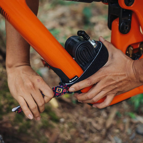 Rockband Frame Carrying Strap For Inner Tubes And Bike Tools, Easy Frame Mounted Storage For Mountain Biking Essentials, No Backpack Needed, Keep Spare Tubes And Tools Within Reach On Every Ride securing tools to orange bike frame